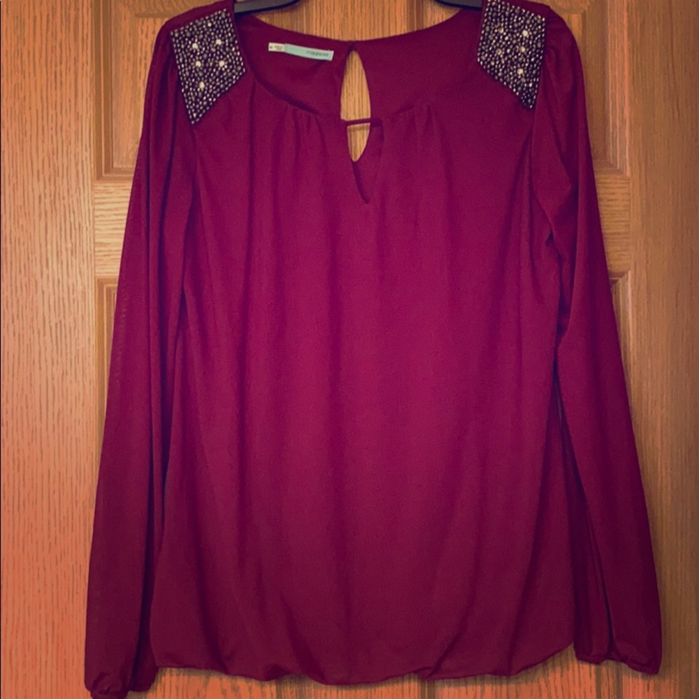 Blouse with embellished shoulders